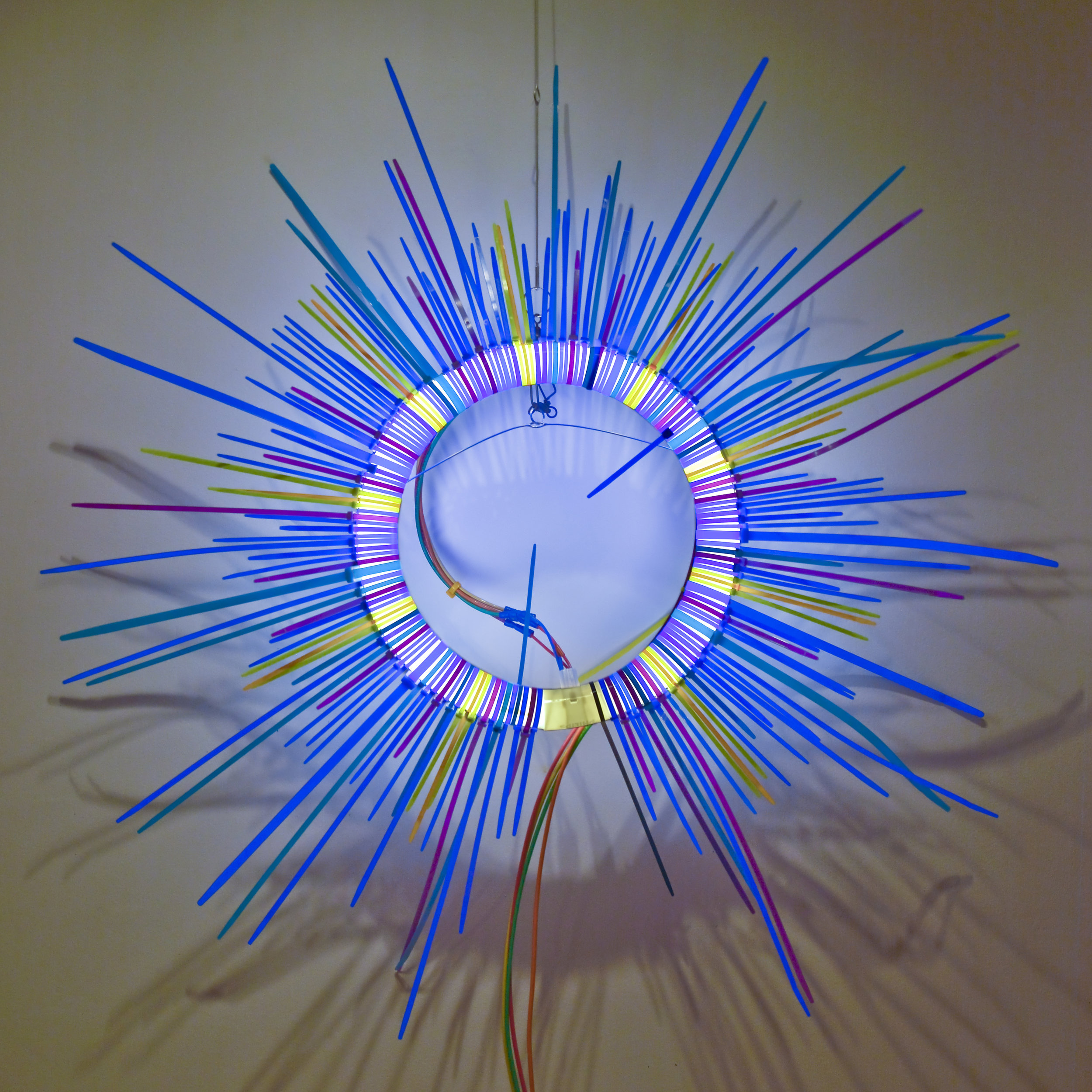 Blue Ring   Fluorescent Lamp, color snap ties, loom heddles and fishing spinners and color wire 12 in lamp diameter 24 in overall